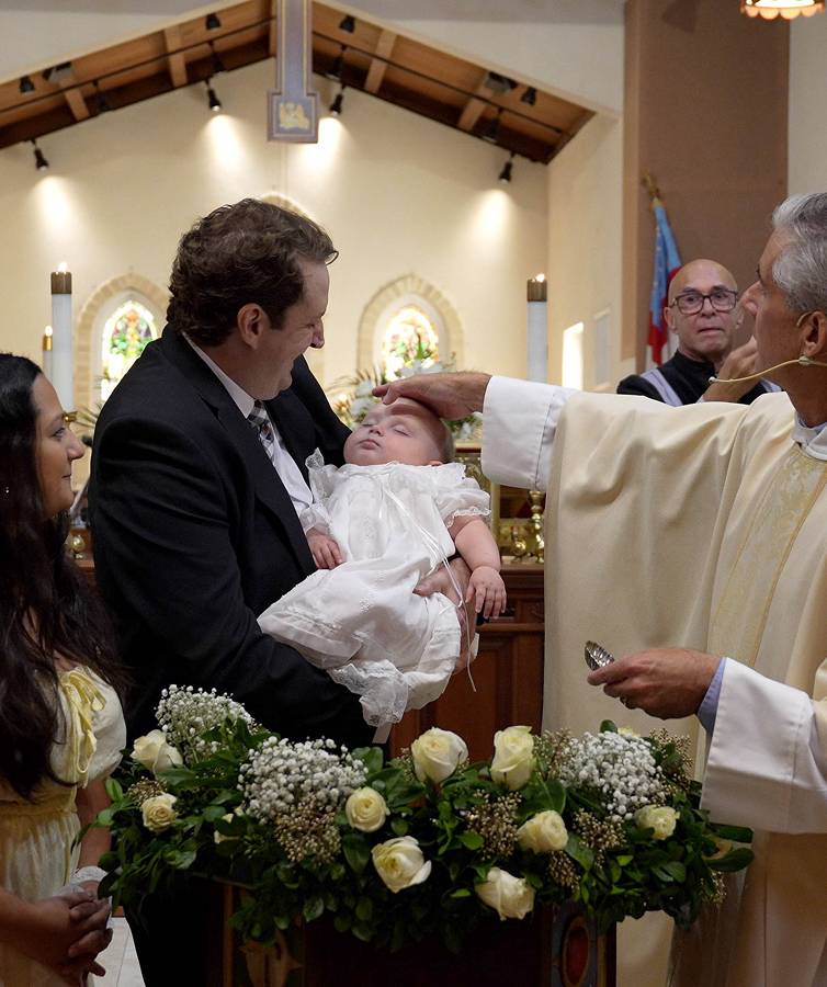 Pastor baptising child